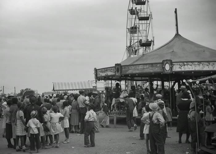 The crowded midway in front of the carousel